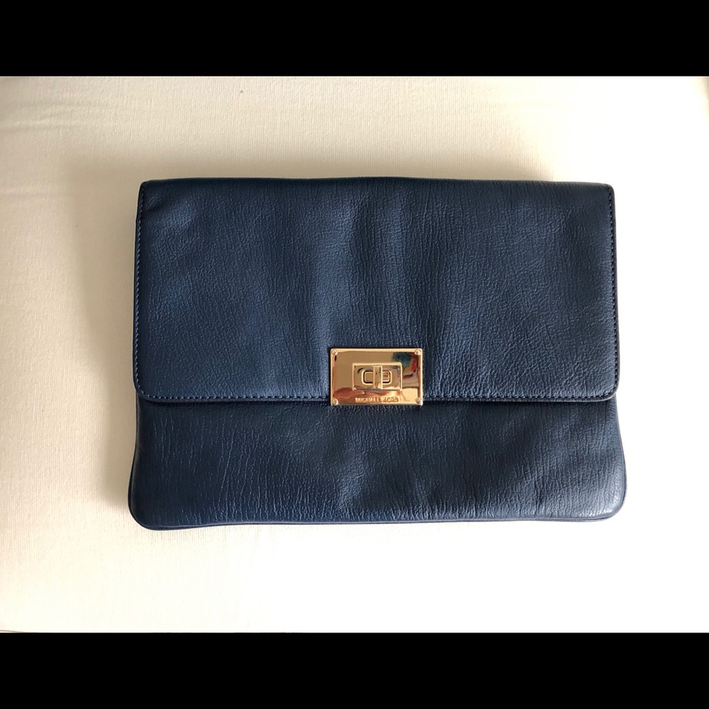 Michael Kors envelope clutch and crossbody purse.